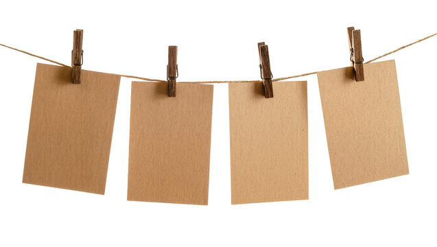 Four blank brown paper cards clipped to a twine string, isolated on transparent background