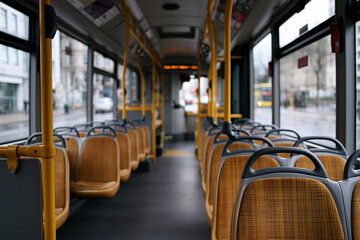Fototapeta premium Bus interior with empty seats during rainy weather
