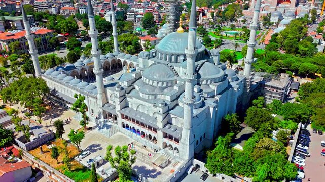 Drone view of the Blue Mosque in Istanbul, Turkey. Sultanahmet Camii is surrounded by green gardens, historic streets and the dense cityscape of old Istanbul.