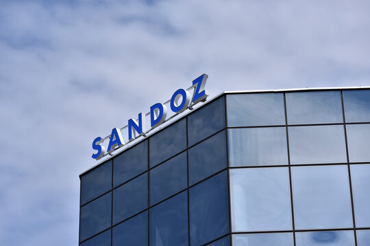 Sandoz pharmaceutical company signage, logo on the facade. WARSAW, POLAND - JUNE 18, 2026