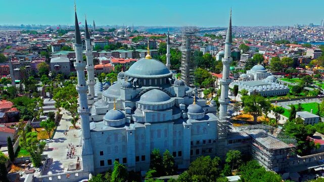 Drone view of the Blue Mosque in Istanbul, Turkey. Sultanahmet Camii rises with grand domes, six minarets and surrounding historic streets.