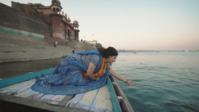 An Indian Traditional girl on a Boat in Ganges River Varanasi Video