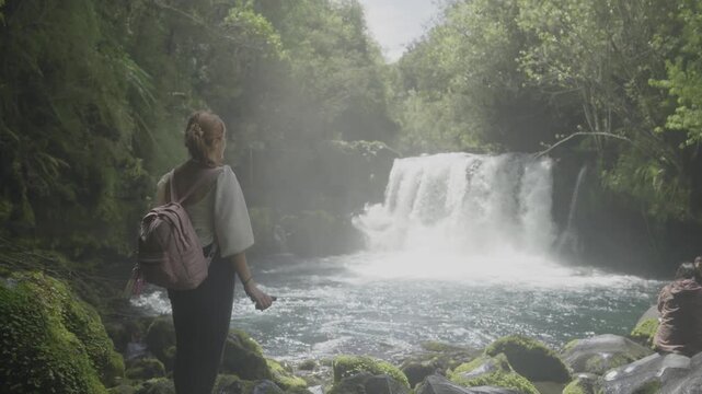 Woman Taking a Selfie in Front of a Waterfall in Southern Chile