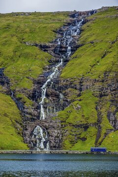 Waterfall tumbling down the hill, Streymoy, Faroe islands, Denmark