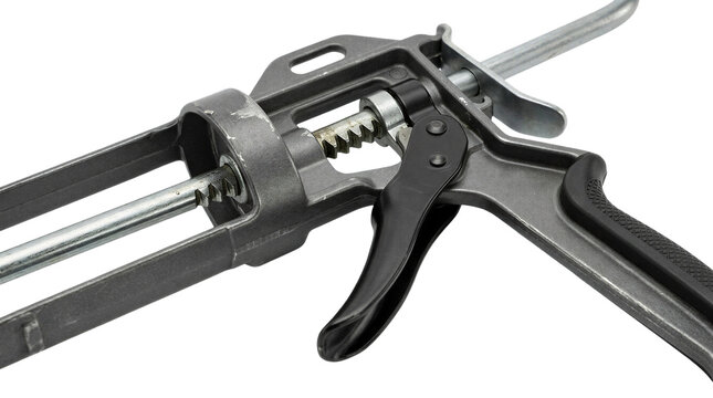 Close-up of caulk gun on transparent background, isolated tool