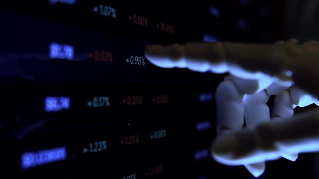 AI robotic hand scanning computer monitor for cyber security threats . Data protection metaphor, cybernetic arm closeup shot  of shallow depth of field, dim light.