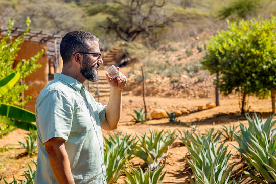 Artisan Distiller Evaluating Quality of Clear Agave Spirit