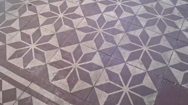 Vintage decorative floor tiles featuring geometric star patterns motion video footage