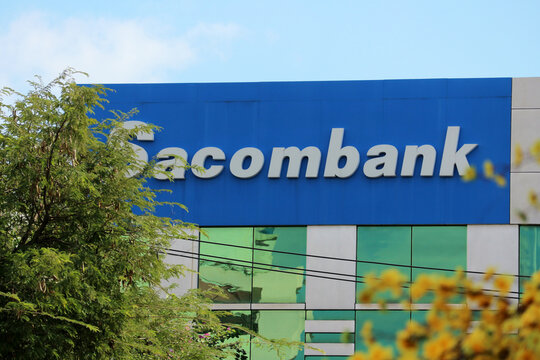 NHA TRANG, VIETNAM - JANUARY 26, 2026: A large blue Sacombank corporate sign on a modern building facade on a city street.