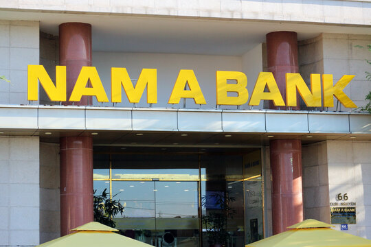 NHA TRANG, VIETNAM - JANUARY 26, 2026: A close-up view of the corporate sign text of Nam A Bank above the entrance to a branch on a city street.