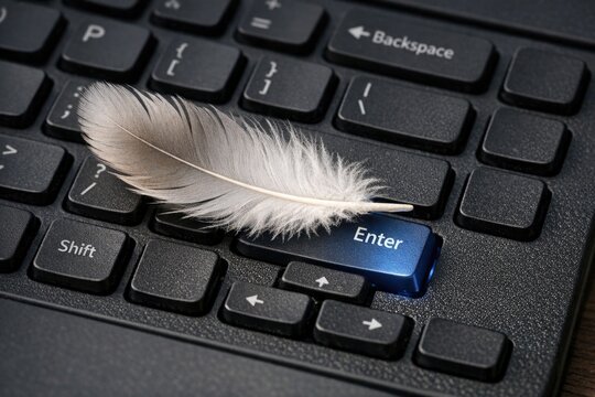 A feather rests on a computer keyboard