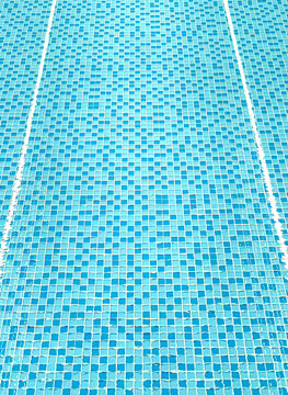 Swimming pool blue mosaic tiles with water ripples