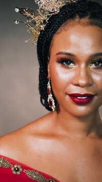 Portrait joyful happy fantasy african american woman princess, beautiful smiling eyes face mouth red lips makeup. Queen girl in love joy looking at camera. Carnival costume dress crown. vertical video