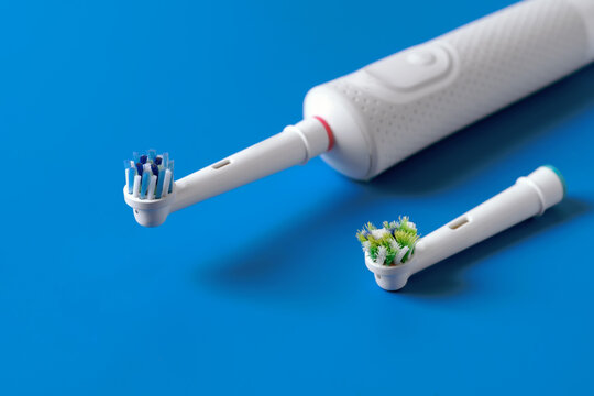 A new replace head for an electric toothbrush and old electric toothbrush  head.