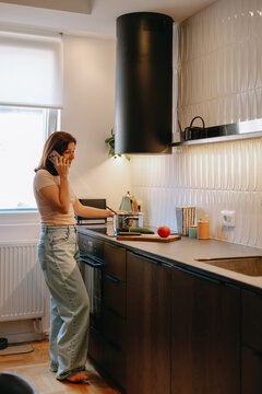Woman Cooking In The Kitchen