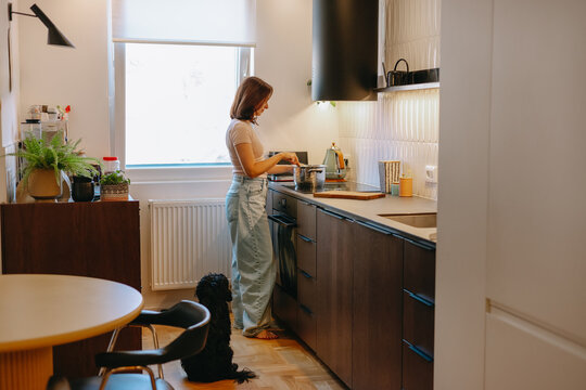 Woman Cooking In The Kitchen