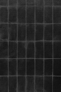 Black Stone Tile Wall Texture: Dark Minimalist Rectangular Brick Block Pattern Surface, Elegant Charcoal Granite Floor Grid Background, Architectural Ceramic Panel Backdrop for Copy Space.