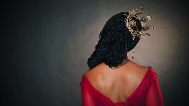 fantasy portrait happy african american woman princess smiling face. Girl queen golden crown on head carnival costume holiday make-up. Red evening dress ball gown back rear view. Medieval fairy.