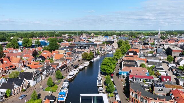 Aerial view of a historic canal town with boats in Europe