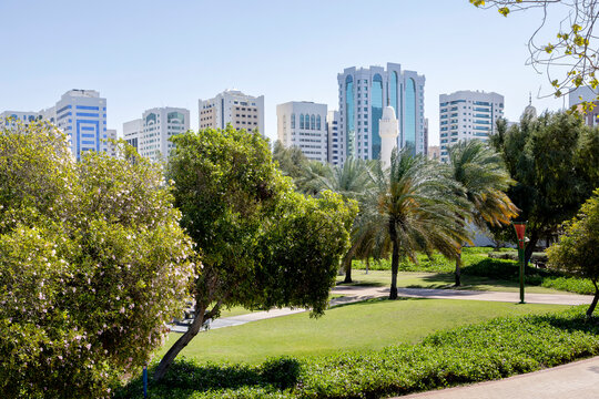 Modern cityscape with greenery, view from Family park in Abu Dhabi, UAE