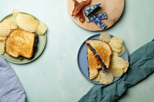 Ube gouda cheese and bacon grilled cheese and chips, from above.