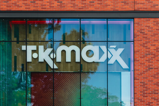POLAND, GDANSK, JUNE 19, 2026 TK Maxx logo is displayed on a glass retail store facade beside a red brick wall