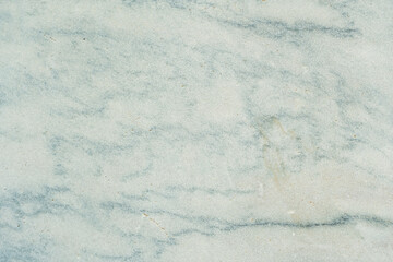 Obraz premium Horizontal close up photo of smooth white and light blue marble texture. Elegant natural stone background with soft organic veining patterns for luxury interior design