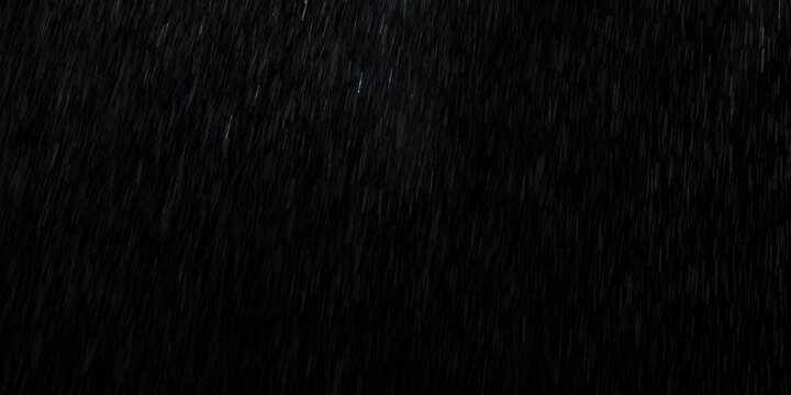 Heavy rain falling in dark night scene with continuous water drops creating dramatic rainfall effect and wet atmosphere during stormy weather