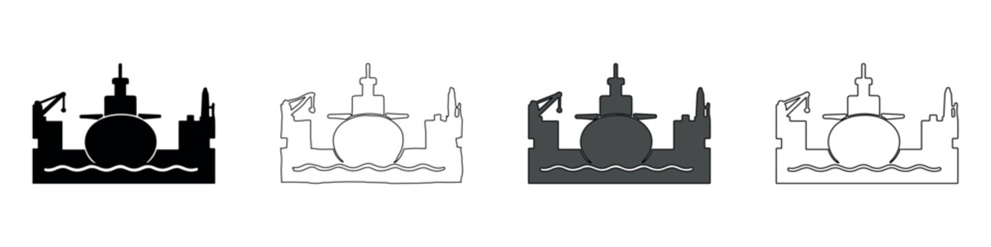 Submarine in dry dock with cranes and industrial structures
