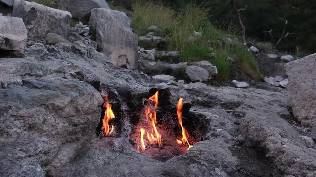 The eternal flames of Mount Chimaera (Yanartas) near Cirali, Turkey. A natural phenomenon where methane gas burns spontaneously from crevices in the rocky mountainside