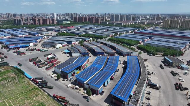 Aerial view of a large logistics park with warehouses and industrial facilities in Rizhao
