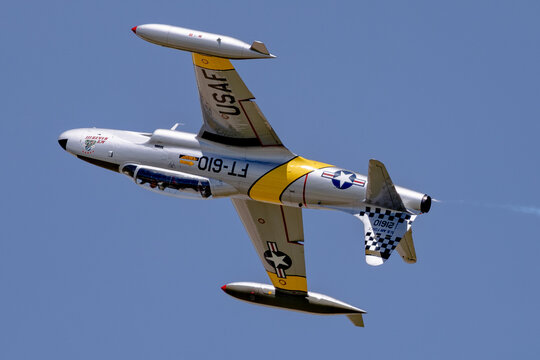 Ace Maker III T-33 Shooting Star banking with tip tanks