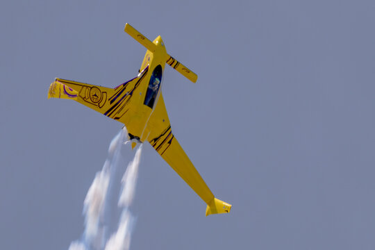 Kyle Fowler Long-EZ aerobatic aircraft climbing with smoke
