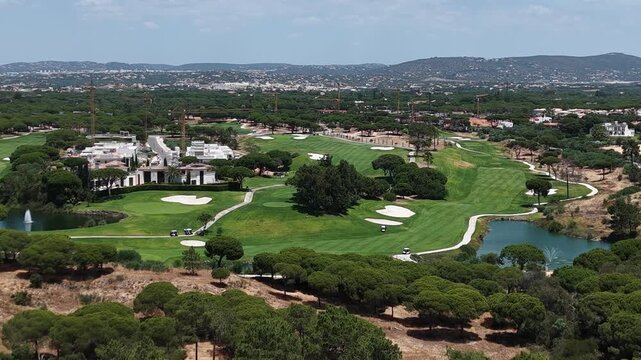 Golfers on the golf course, aerial view.
