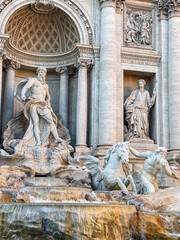 Obraz premium Vertical Shot of Baroque Sculptures and Water Cascade at Trevi Fountain