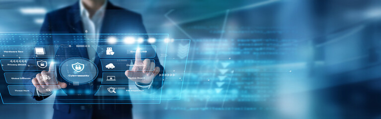 Security analyst swiftly tracing threats using hands deploying Cybersecurity defenses over a complex virtual screen displaying network firewalls. Protecting sensitive company data safely. © FutureLogic Studio