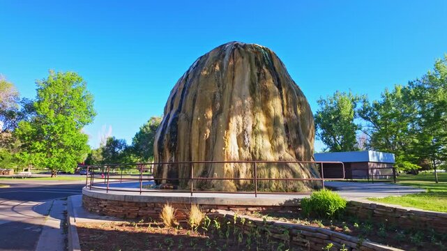 View of the TePee Fountain mineral spring at Hot Springs State Park in Thermopolis Wyoming with towering travertine deposits