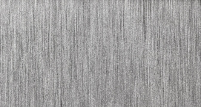 Supermacro 2:1 close-up of stainless steel 304 sheet showing fine satin brushed surface texture with micro-scratches and metallic sheen.