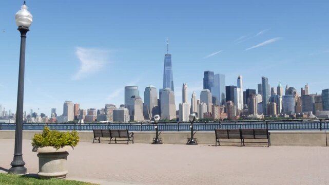 New York City Manhattan Downtown Financial District skyline, World Trade Center tower, cityscape from New Jersey Liberty state park, United States. Hudson river waterfront walkway, skyscraper building