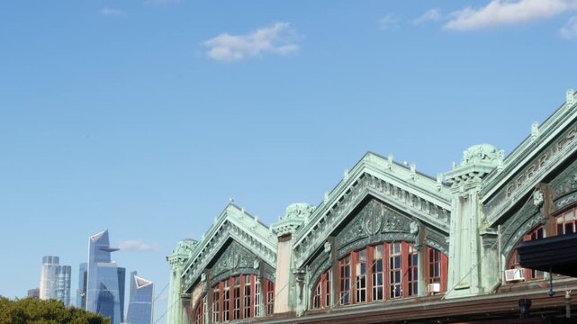 New York City Manhattan Midtown Hudson Yards towers from New Jersey, old historic ferry boat terminal 1907, Hoboken, United States. American highrise skyscraper building and green cooper architecture.