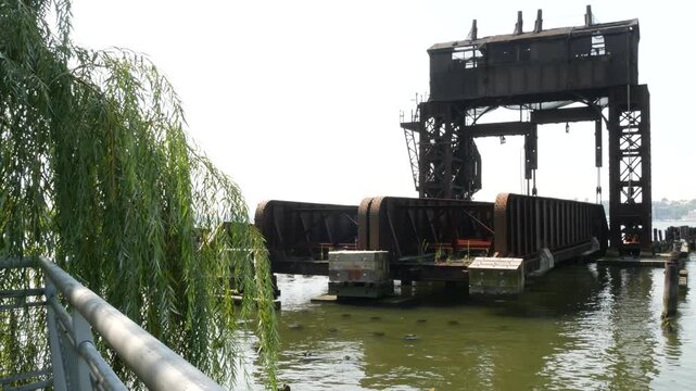 New York City Riverside Park South Manhattan United States. Industrial gantry dock, retro pier in Upper West Side. Hudson river riverfront historic metal vintage crane, old freight port terminal, USA.