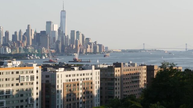New York City Manhattan Downtown Financial District, World Trade Center from New Jersey, Weehawken Port Imperial, United States. Urban cityscape with skyscraper building, American architecture. River.