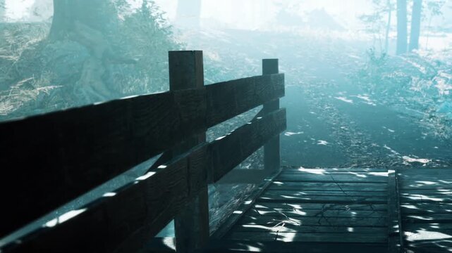 A wooden bridge connects two sides of a path in a forest. Fog covers the ground and soft light filters through the trees. The scene shows natures quiet moments in the morning light.