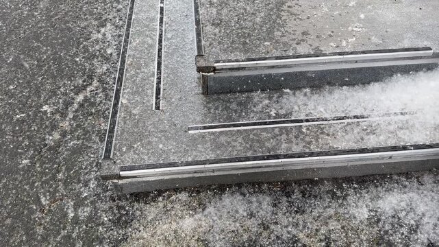 Poplar fluff accumulation on outdoor steps, showing gradual buildup and surrounding details