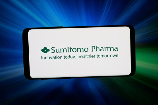 Stuttgart, Germany - 06-22-2026: In this photo illustration, the logo of Japanese company Sumitomo Pharma Co. Ltd. is displayed on a smartphone in front of abstract background on computer screen.