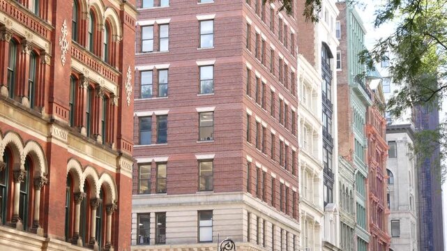New York City urban buildings architecture, Manhattan Broadway street United States of America. Red brick classic house, USA. Typical old historic real estate property in NYC.