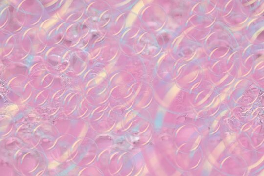 Pink Iridescent Abstract Bubble Texture Background with Soft Fluid Patterns, Dreamy Pastel Pink Holographic Background with Liquid Swirls, Elegant Pink Glass Bubble Surface Texture for Creative Design