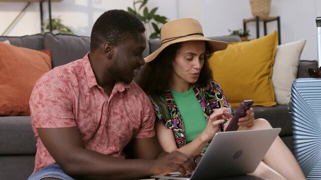 Interracial couple successfully booking flight tickets online
