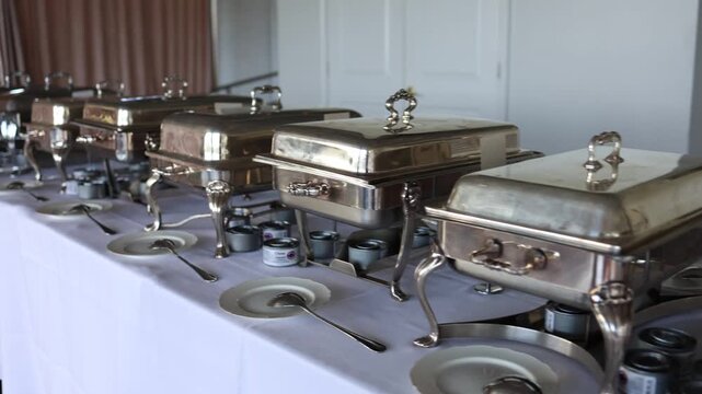 Buffet chafing dishes on catering table