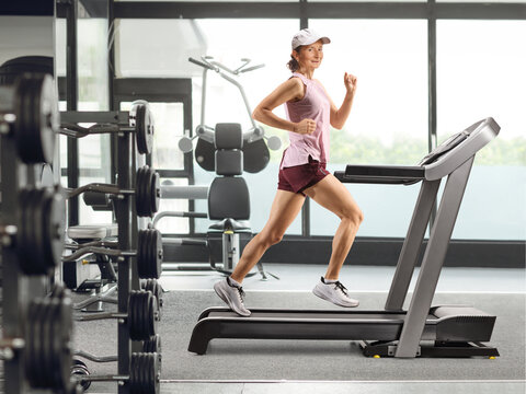 Woman running on a treadmill at a gym